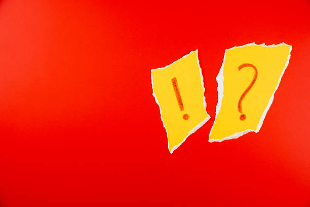 Yellow paper torn with exclamation mark and question mark ?!? on vibrant red background for attention-grabbing visuals in marketing and communication materials