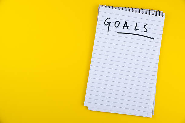 istock Notepad with GOALS written on it against a bright yellow background for planning and motivation purposes, goals, objective, planning and strategy 2226594570