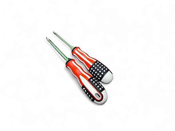 Two screwdrivers with American flag handles on a white surface