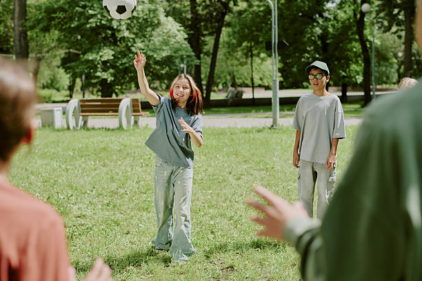 istock Multiethnic Children Playing Ball Game in Park 2226598203