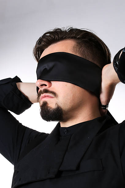 istock A man with his eyes blindfolded. Studio photo. High quality photo 2226599305