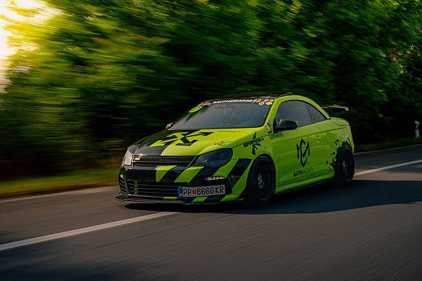 Moscow, Russia - May 25, 2019: Tuned car blue Toyota Celica T23 with airbrushing blue and green in the form of a flame. It is in the field during summer meeting of owners
