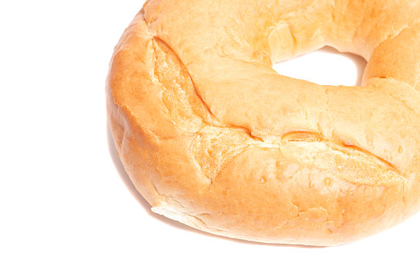 Fresh wheat round white bread bagel isolated on white background, top view.