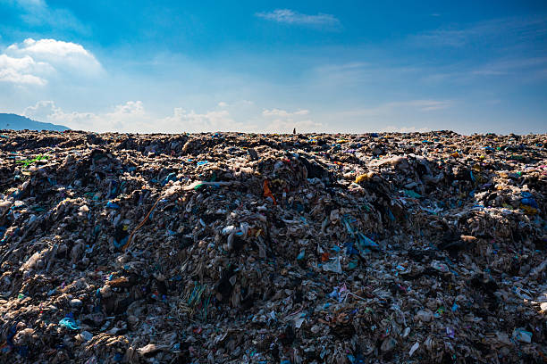 Truck unloading soil at a landfill site. Environmental damage. Waste