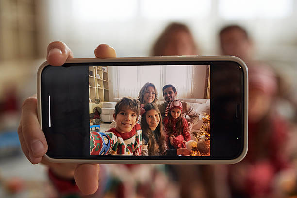 Young family of five taking selfie on New Year’s day.