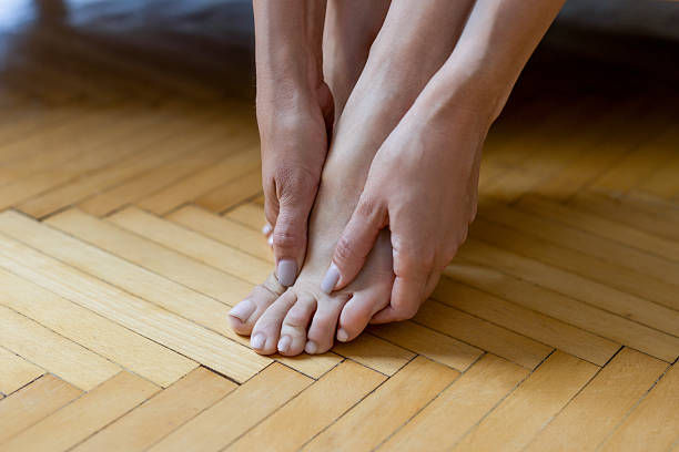 istock Unrecognizable woman experiencing foot pain 2226607201