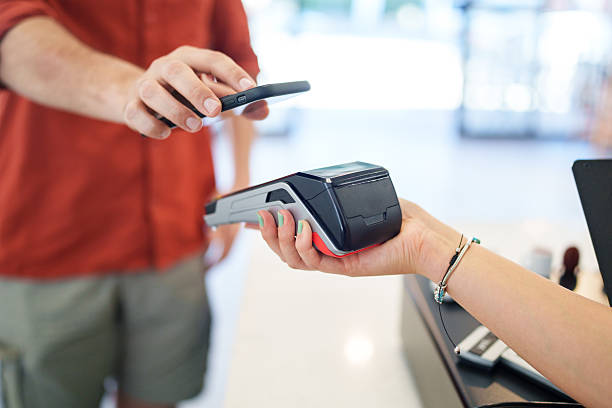 istock Close-Up of Mobile Phone Making Contactless Payment on Card Reader 2226607891