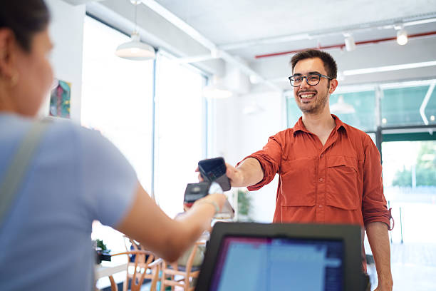 istock Cafe Employee Accepting Contactless Payment from Customer 2226607923