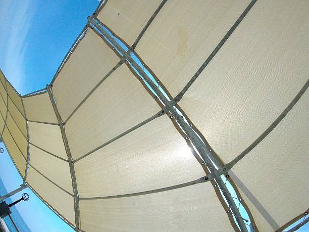 istock abstract background white canvas, roof on the beach, protective awning from the sun, sail, blue sky 2226608035