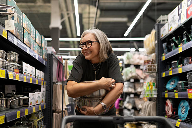 istock Middle-aged woman enjoys shopping experience in a home improvement store while exploring various departments 2226608112