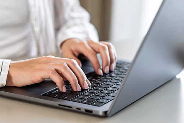 istock Female hands typing on modern laptop keyboard 2226609294