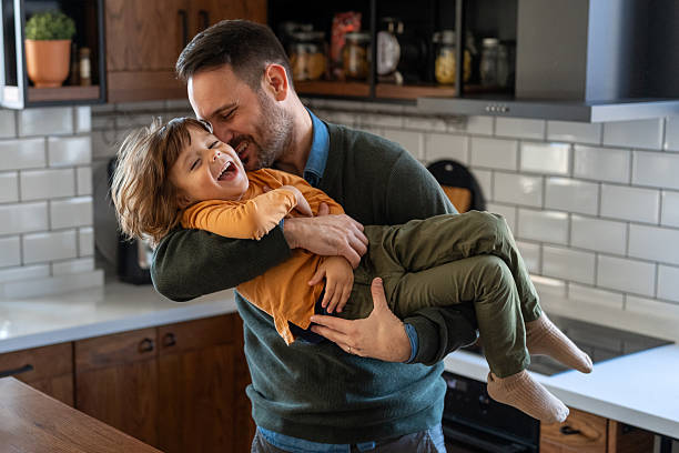 istock Happy loving daddy and affectionate boy playing, laughing having fun at home. Family leisure concept 2226609471