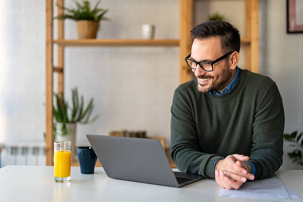 istock Success man typing on laptop, communicating online distantly working or studying on computer at home 2226609781
