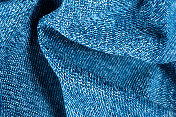 istock Macro View of Wrinkled Denim Cloth with Shadows and Texture. 2226609998