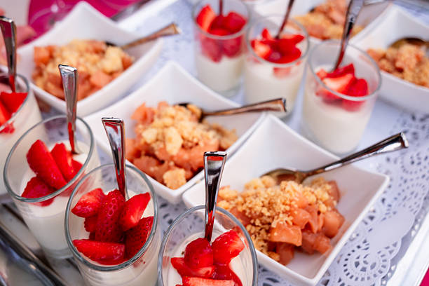 Assorted Mini Desserts with Strawberries and Crumble Topping.