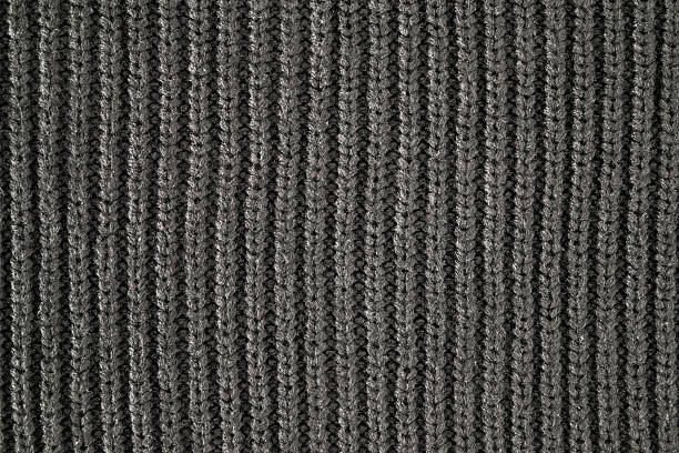 istock Dark gray soft knitted fabric background. Empty place for text. Closeup. Top down view. 2226610779