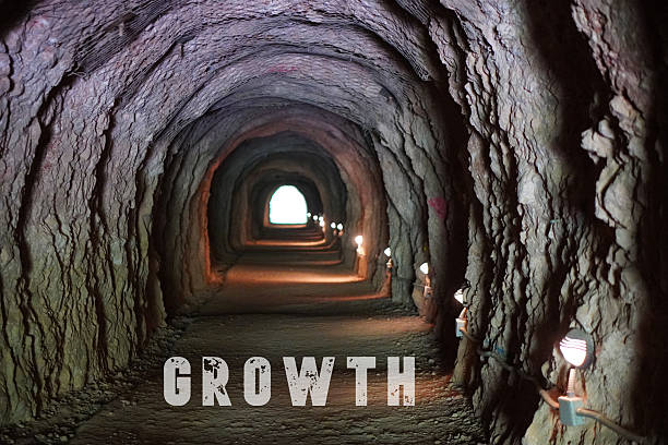 istock Personal Growth and Development Concept. Written Word in a Tunnel with Light at the Exit 2226610818