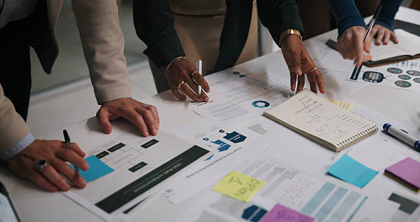 istock Above, hands and business people in office with paper, workflow or mindmap for campaign management at night. Company team, workshop or sticky notes in workplace with documents, planning or late tasks 2226612929