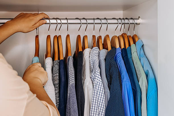 istock Neatly organized wardrobe with colorful shirts. 2226613098