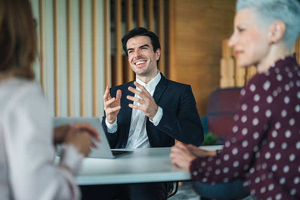 istock Confident team leader leading a discussion in a modern office 2226613631