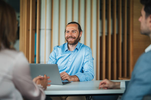 istock Confident team leader leading a discussion in a modern office 2226613632