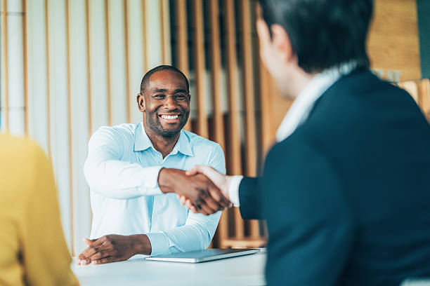 istock Meeting success. Business partners shaking hands 2226613667