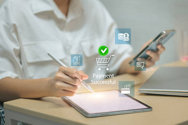 istock A person using a tablet and smartphone completes an online purchase, indicated by a Payment Successful icon. 2226614509