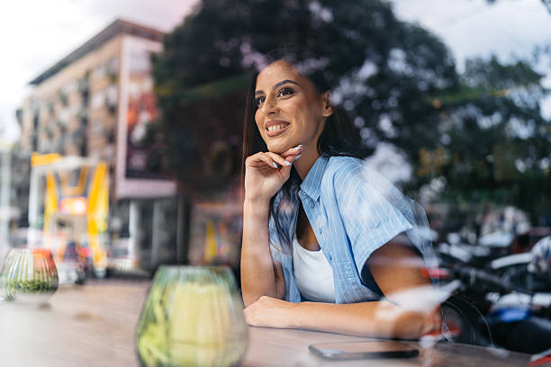istock Young Woman In A Coffee Shop 2226615192