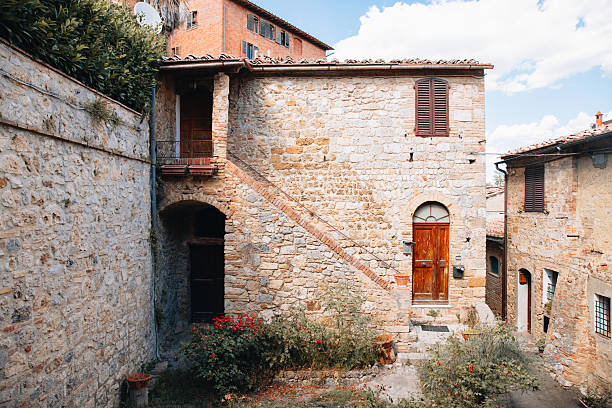 The colorful medieval houses and alleys of a Tuscan village