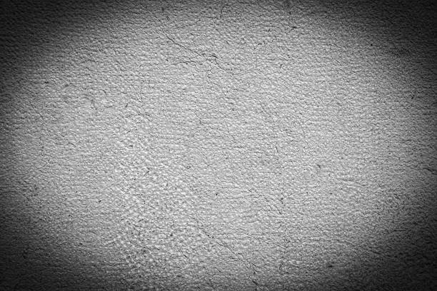 Textured Weathered Wall with Prints and Cracks in Grayscale, Vignette Effect.