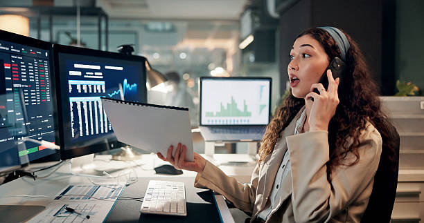 istock Woman, trading and computer screen for phone call, charts or documents for review with wow for stock price. Person, shock and investor at night with lost revenue, smartphone or market stats at office 2226623163