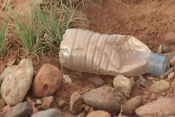 istock A close up of a plastic bottle lying on the ground 2226623907