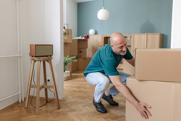 istock Mature man organizing boxes in a new home during moving day 2226624121