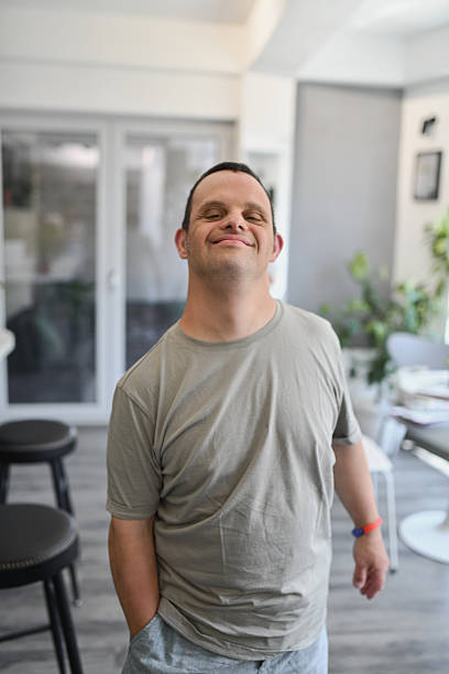 istock Joyful Male With Down Syndrome Posing for Camera With Confidence and Smile 2226624382