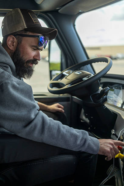 istock Daytime drive – bearded truck driver at work 2226626161