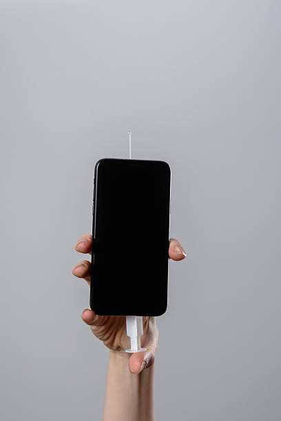 istock Smartphone with Needle Emitting Liquid Droplets Artistically 2226626717