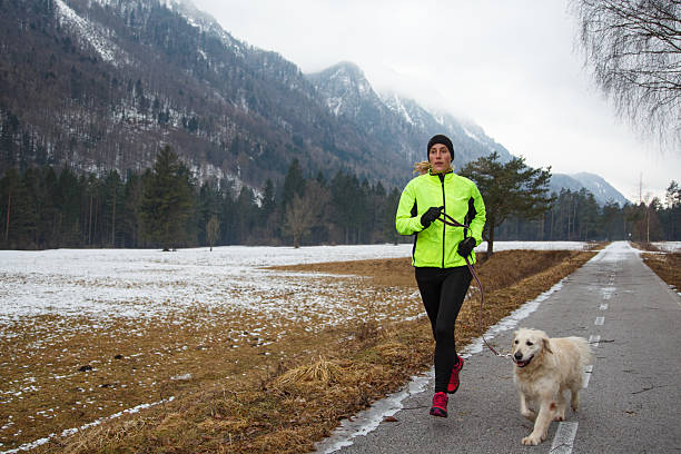 istock Running with dog in winter 2226628876
