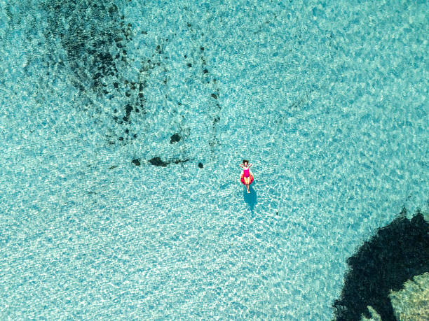 istock Woman Relaxing on Watermelon Float in Pool 2226630623