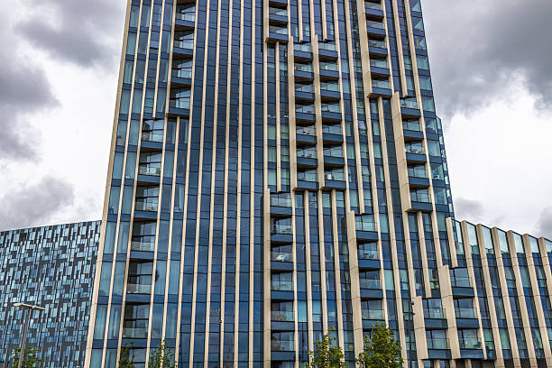 istock Vertical view of modern glass residential skyscraper facade 2226630761