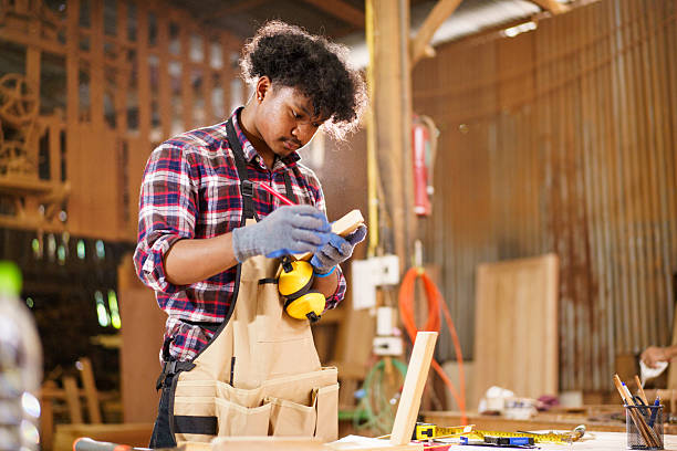 istock Professional African male carpenter is working professionally in sawmill - workshop. 2226631025
