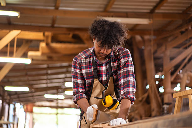 istock Professional African male carpenter is working professionally in sawmill - workshop. 2226631039