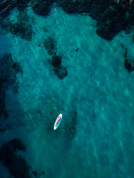 istock Woman Relaxing on Paddleboard in Clear Water 2226631448