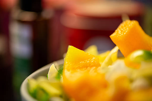 A plate of food with a fish and a lemon on it. The fish is cut into pieces and the lemon is sliced