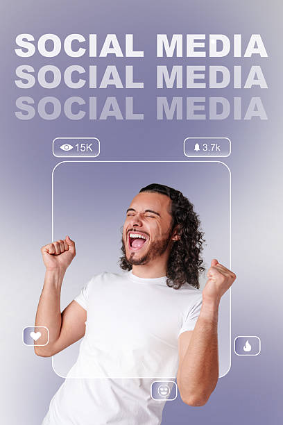 istock Happy man celebrating success with raised fists in a studio against a plain background 2226636546