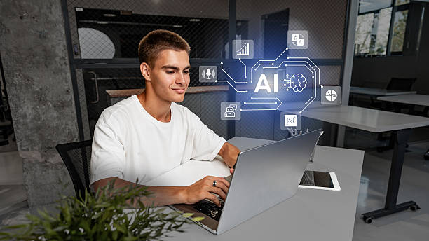istock Engaged young man working on laptop in modern office with AI technology representation 2226636577