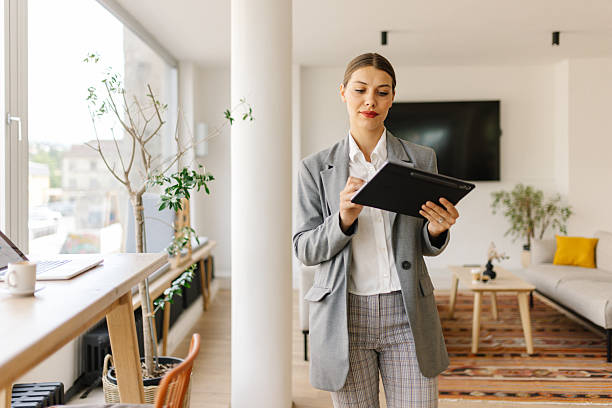 istock Businesswoman Interacting with Tablet in Office 2226637678