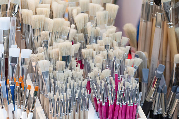 A vibrant display of assorted paintbrushes, showcasing different sizes and styles, perfect for artistic expression and creativity.