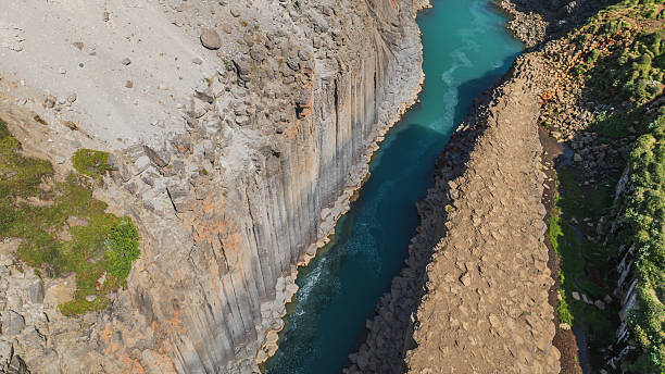 istock Aerial View of Studlagil Canyon with Basalt Columns and Turquoise River 2226639023