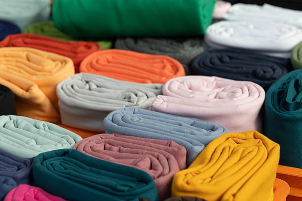 istock Colorful rolled fabric textiles arranged neatly in a vibrant display for creative projects and design 2226639064