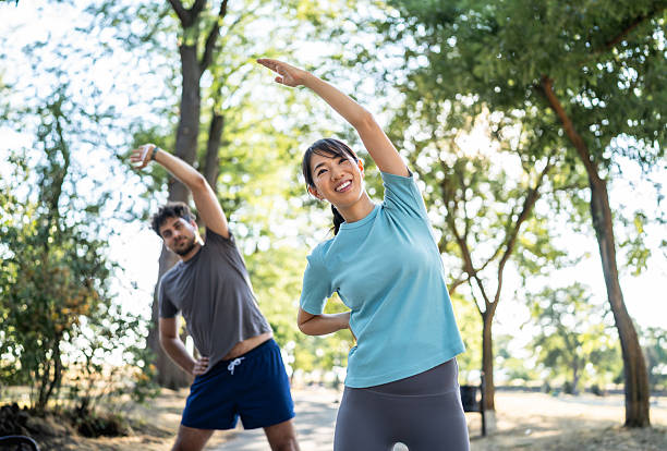 istock Young woman stretching in the park before exercising 2226639316